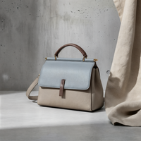 THE STRUCTURED TOP-HANDLE CROSSBODY