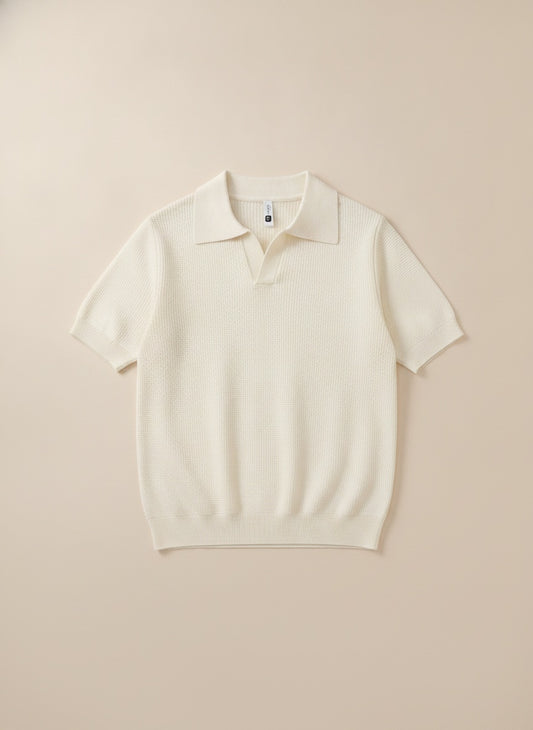 Ivory waffle-knit short-sleeve Johnny collar polo styled with stone tailored trousers, quiet-luxury Mediterranean mood.