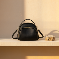 PEBBLED DOME CROSSBODY BAG