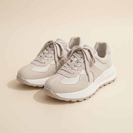 Ivory low-top runner sneakers in pebbled leather and brushed suede with tonal laces and chunky white lugged sole.