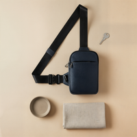 NAVY PEBBLED LEATHER CROSSBODY SLING