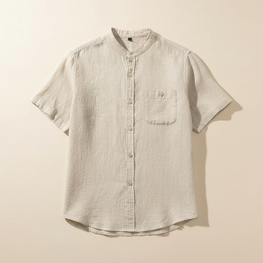 Ivory mandarin-collar short-sleeve shirt with tonal buttons and chest pocket, styled with stone wide-leg trousers.