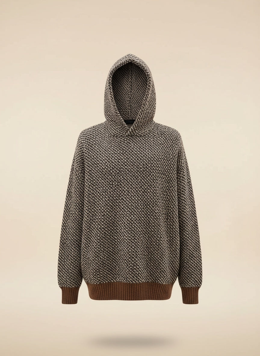 Textured knit sweater in soft taupe styled with tonal tailored trousers, quiet-luxury studio portrait.