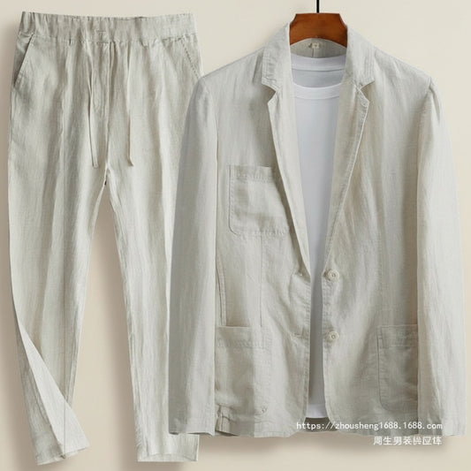 Ivory linen suit styled with tapered trousers, photographed in a sunlit studio with soft Mediterranean light.