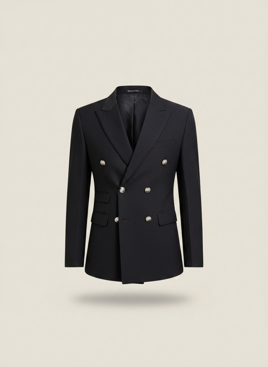 Navy double-breasted blazer with silver-tone buttons and tailored slim silhouette, styled on a warm neutral studio backdrop.