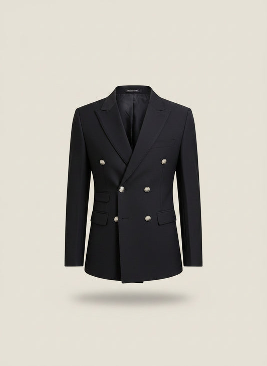 Navy double-breasted blazer with silver-tone buttons and tailored slim silhouette, styled on a warm neutral studio backdrop.
