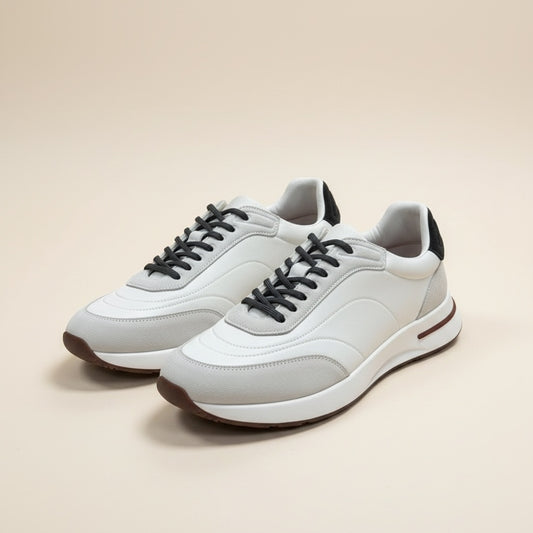 Low-top retro runners in white leather with grey suede panels, dark laces, and a burgundy-striped white midsole.