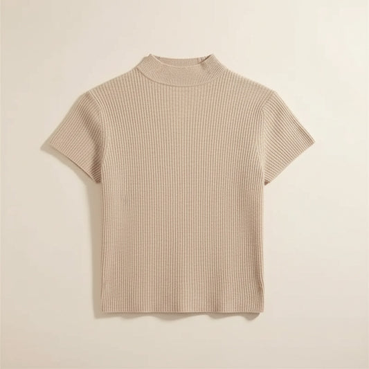 Oatmeal ribbed knit mock neck short-sleeve top styled with ecru trousers, soft daylight studio — quiet-luxury essential.