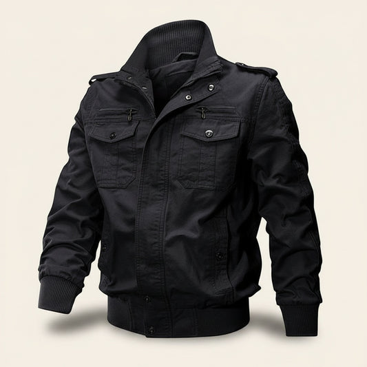 Black cotton field bomber jacket with stand collar, twin flap chest pockets and ribbed cuffs, styled with ecru trousers.